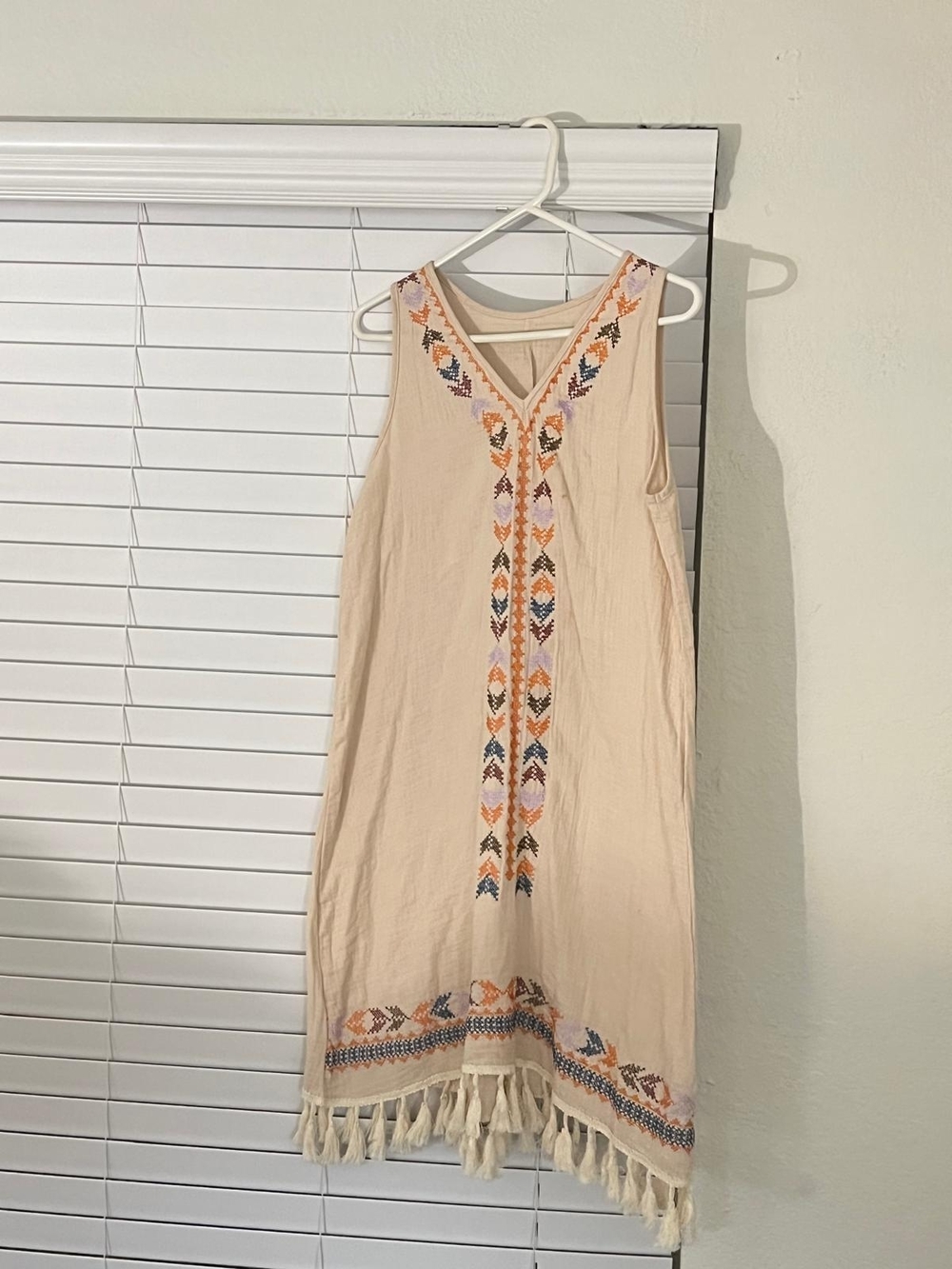 Sleeveless Embroidered Tassel Hem Dress in Cream